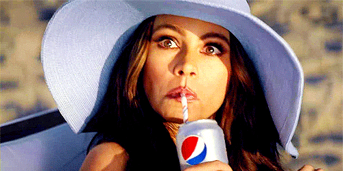 Sophia Vergara sipping a Pepsi.